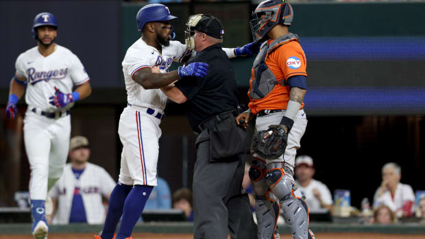 Rangers right fielder Adolis García yells at Astros catcher Martín Maldonado during Game 5 of the ALCS on Oct. 20, 2023.